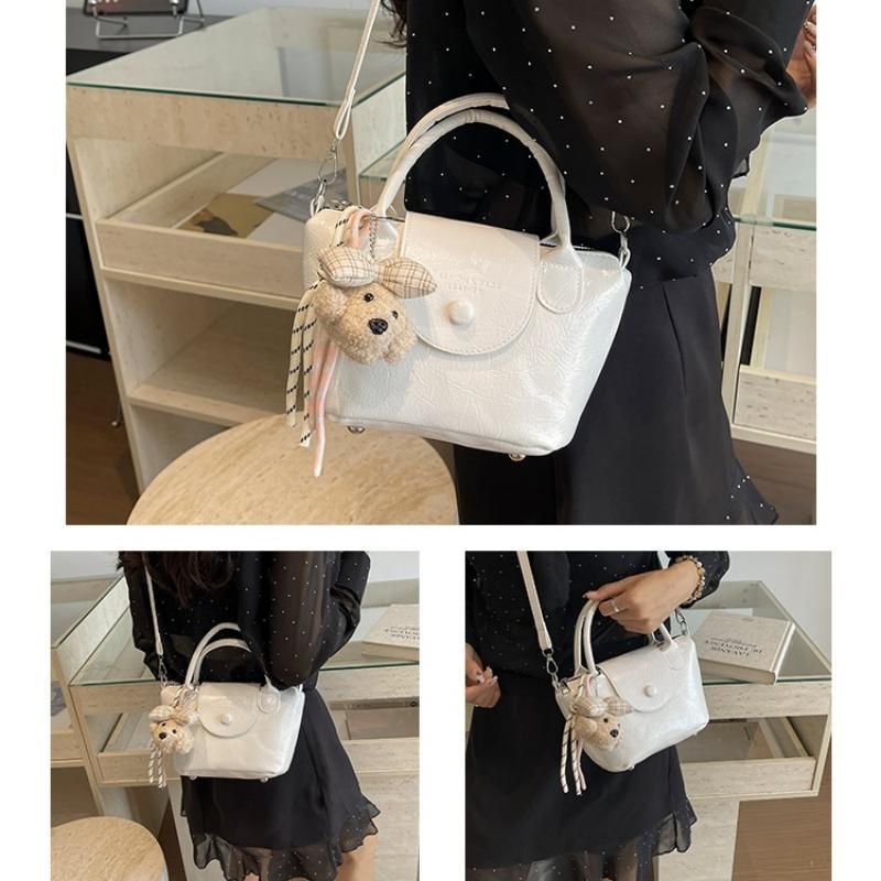 White Compact PU Leather Crossbody Bag With a pendant- Lightweight Handheld Shoulder Purse with Adjustable Strap, Zipper Closure and Metal Feet for Women, Daily Commute and Travel