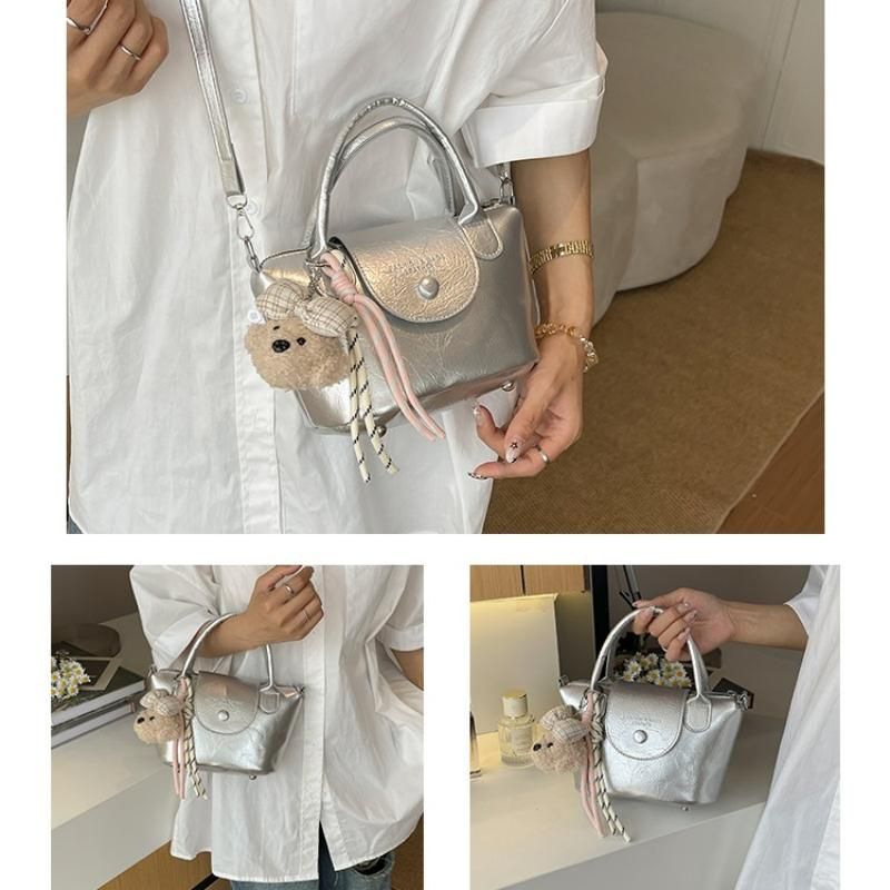 Silvery Compact PU Leather Crossbody Bag With a pendant- Lightweight Handheld Shoulder Purse with Adjustable Strap, Zipper Closure and Metal Feet for Women, Daily Commute and Travel