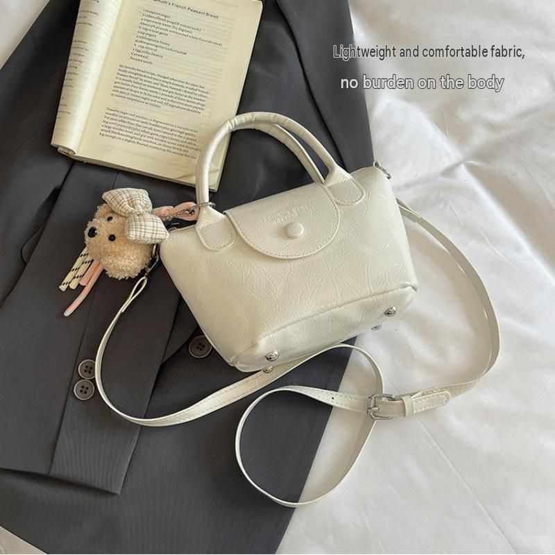 White Compact PU Leather Crossbody Bag With a pendant- Lightweight Handheld Shoulder Purse with Adjustable Strap, Zipper Closure and Metal Feet for Women, Daily Commute and Travel